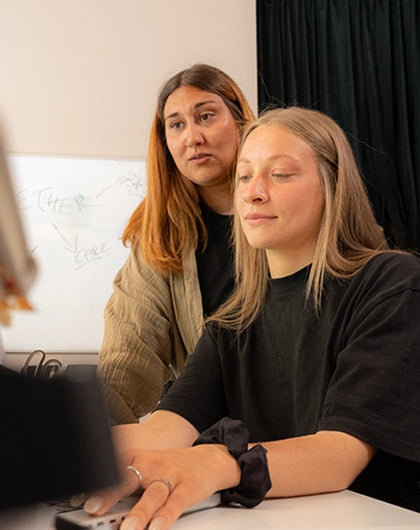 Writing the one-line brief in a notebook at the Growgether studio