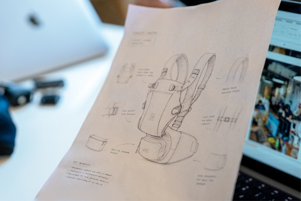 Hand-drawn concept sketch of a Growgether baby carrier